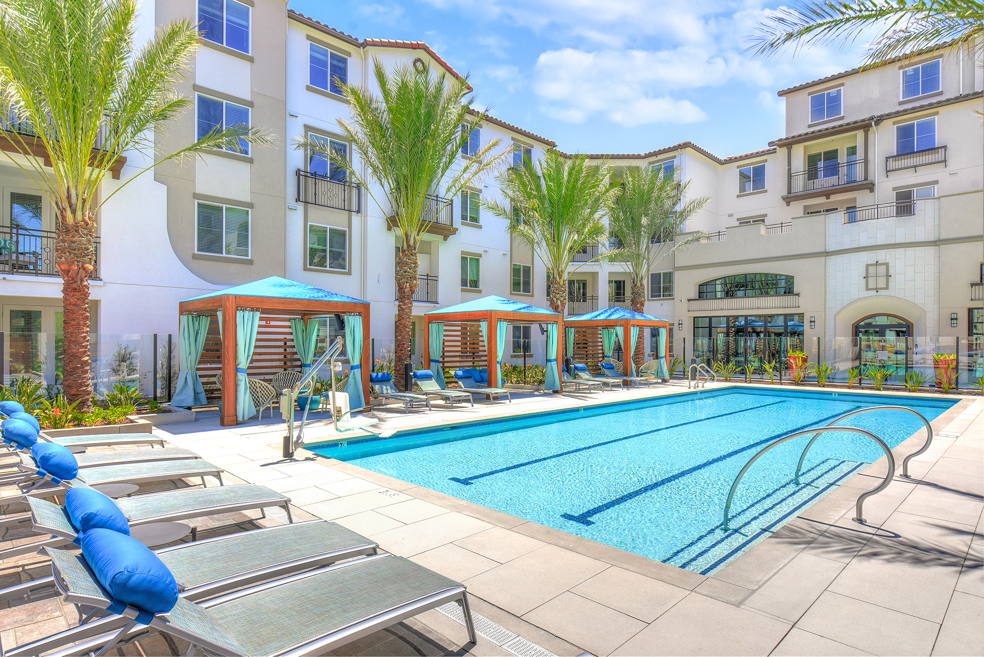 Resort-style pool with cabanas